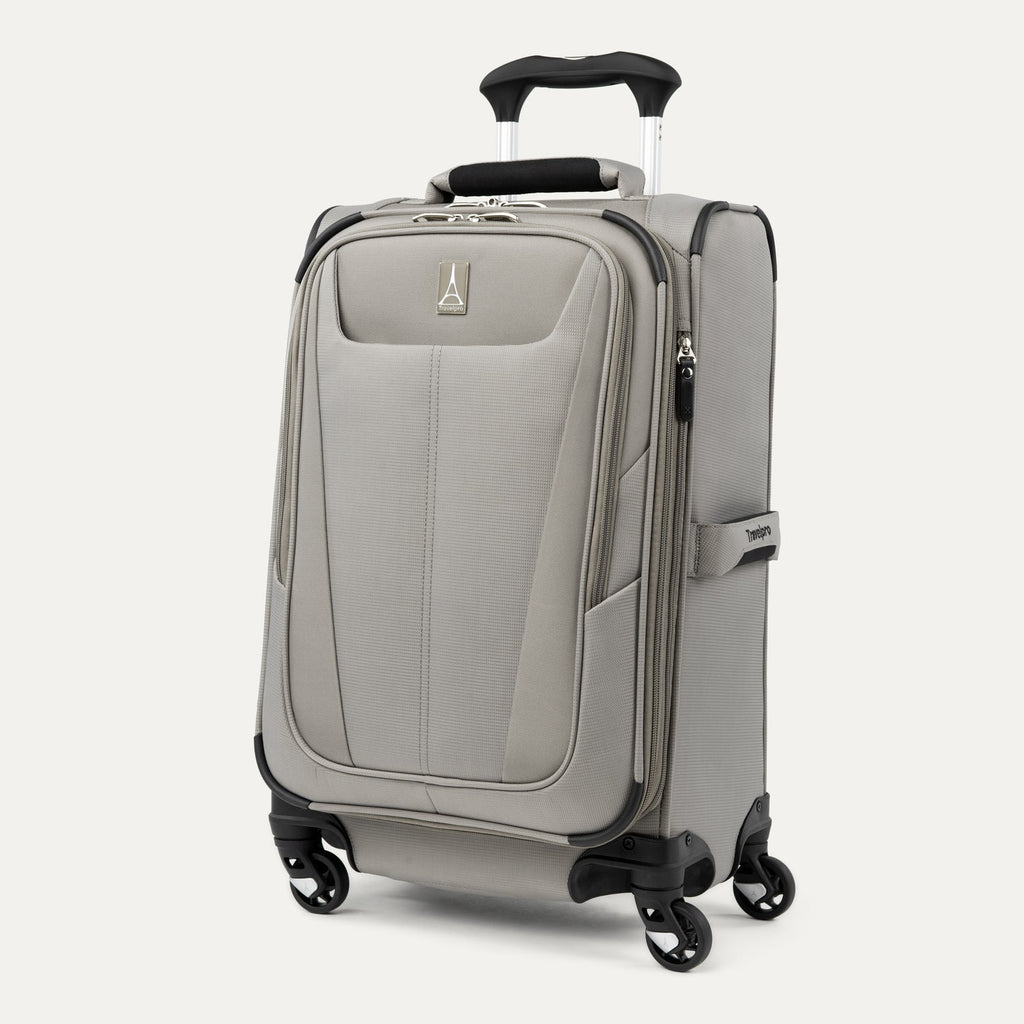 Slanted front view of Maxlite® 5 Carry-On Spinner in gray, featuring a front zippered pocket, four 360° spinner wheels, a side handle, and a lightweight softside construction.
