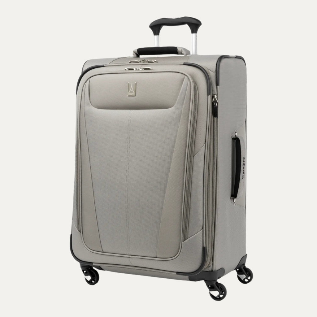 Slanted front view of the medium size Maxlite® 5 Expandable Spinner in gray, showcasing its sleek design, side carry handle, and four spinner wheels