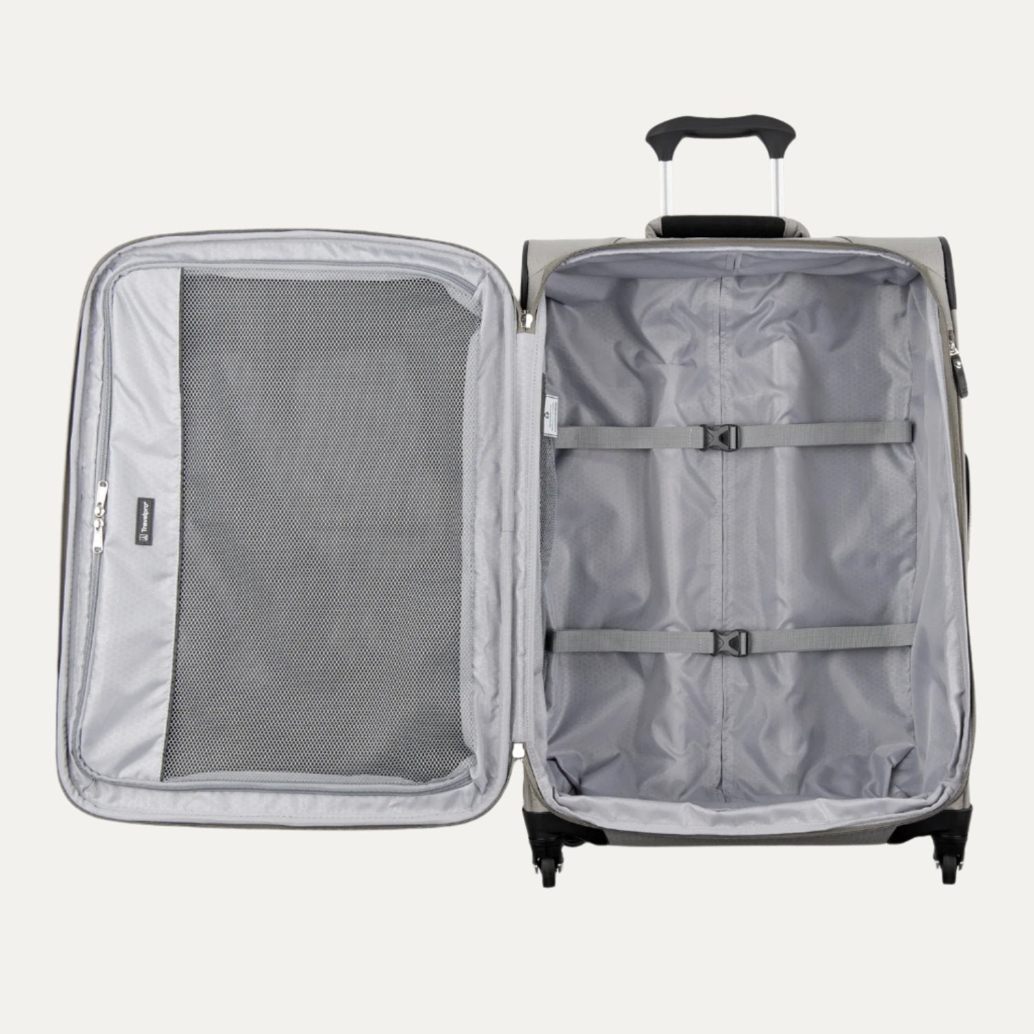 Interior view of gray Maxlite 5 Medium Expandable Spinner suitcase, showing open main compartment with adjustable tie-down straps on one side and a full-length zippered mesh pocket on the lid.
