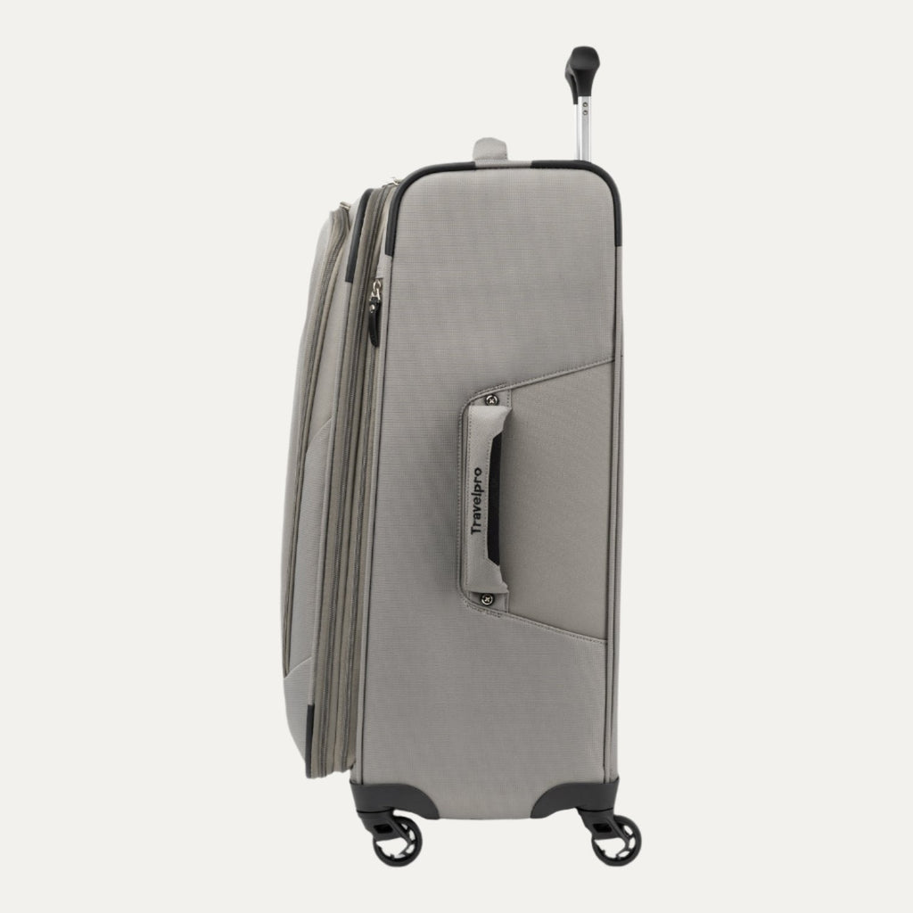 Side view of the medium size Maxlite® 5 Expandable Spinner in gray, featuring the side carry handle, zipper expansion, and smooth-rolling spinner wheels.

