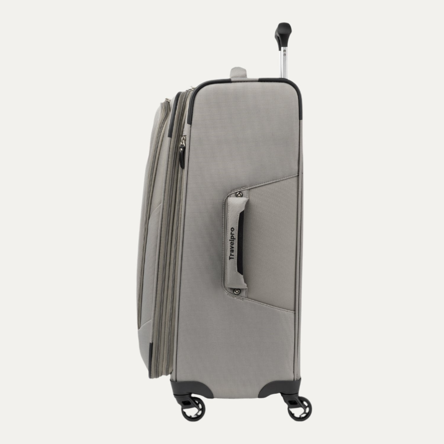 Side view of the medium size Maxlite® 5 Expandable Spinner in gray, featuring the side carry handle, zipper expansion, and smooth-rolling spinner wheels.
