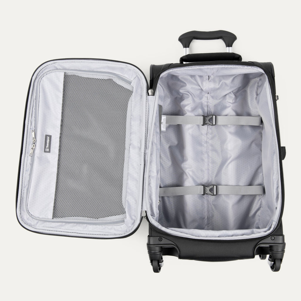 Open black suitcase with interior compartments on a white background