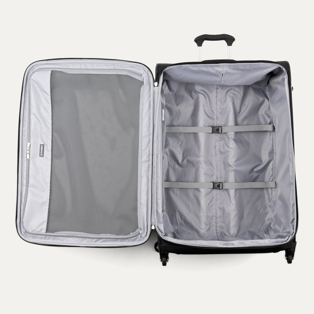 Open suitcase with interior compartments on a white background