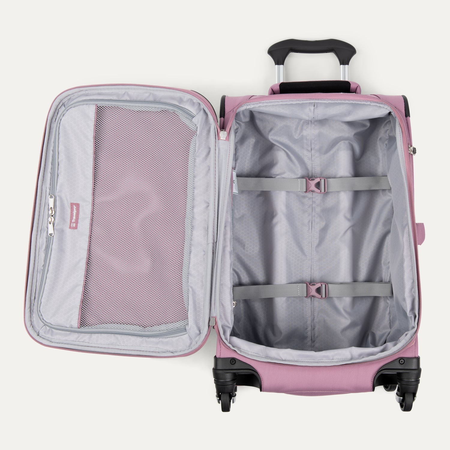 Pink suitcase with open compartment on a white background