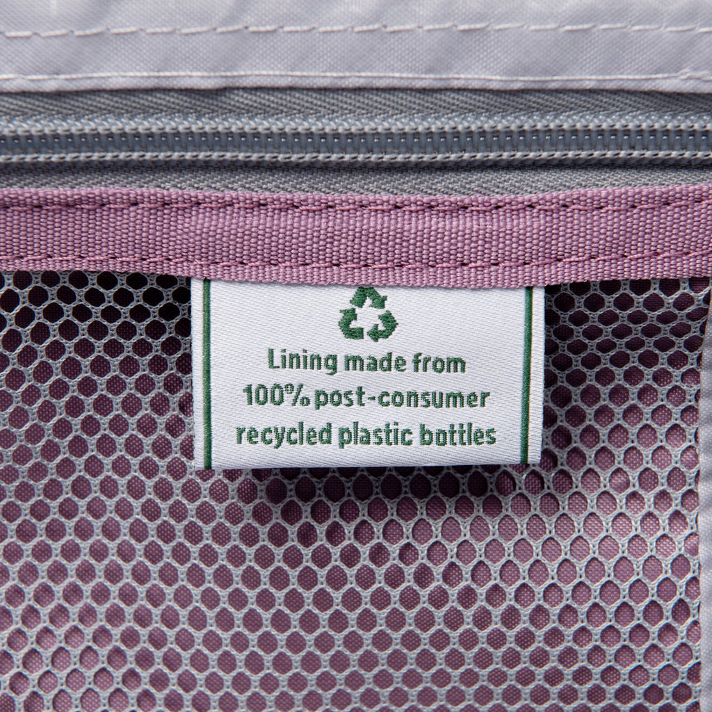 Label on a product indicating lining made from 100% post-consumer recycled plastic bottles.