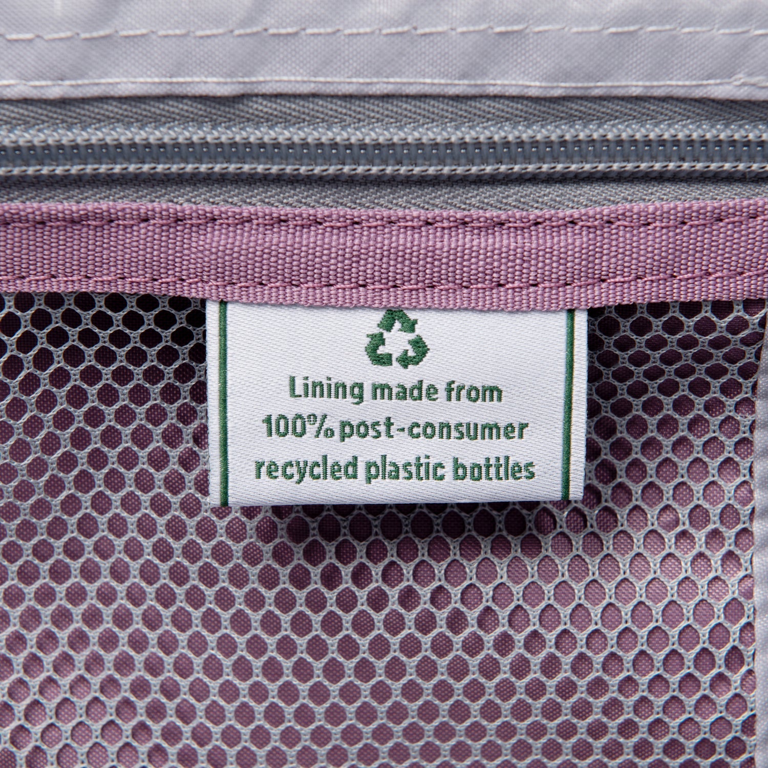 Label on a product indicating lining made from 100% post-consumer recycled plastic bottles.