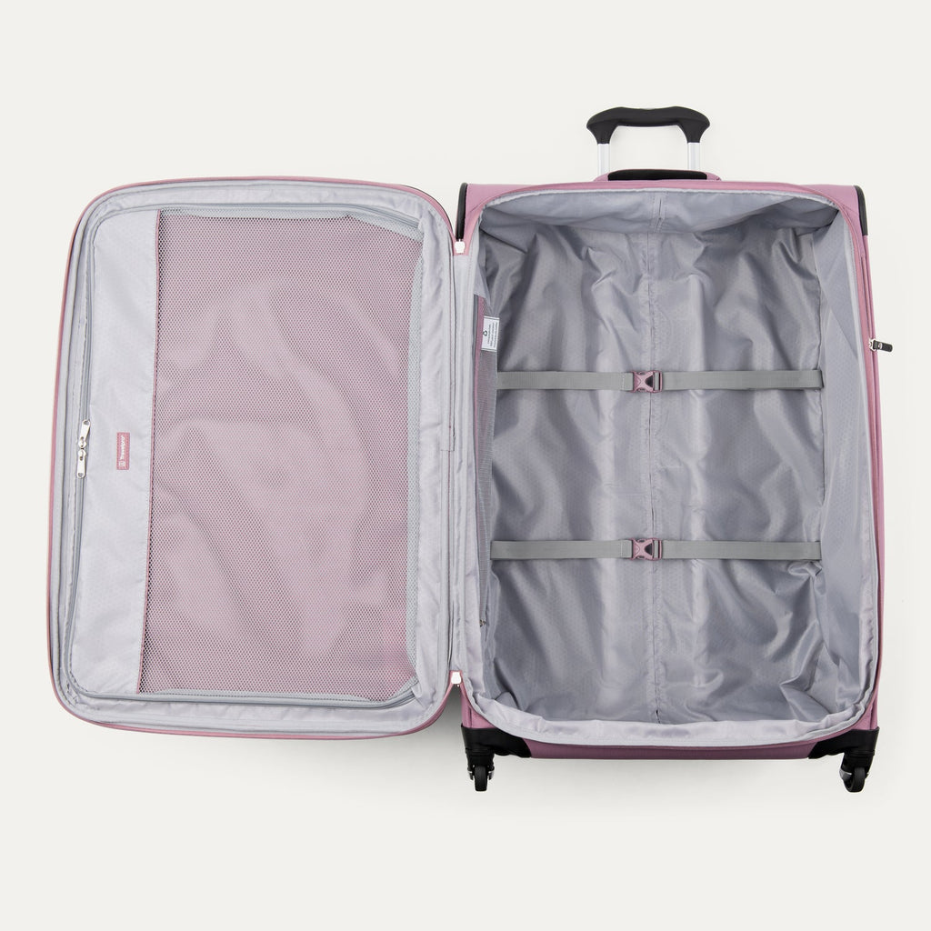Open pink suitcase with interior compartments on a white background