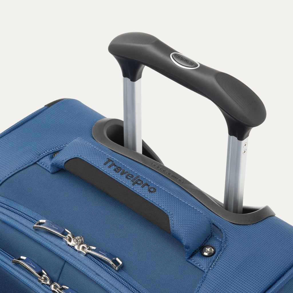 Blue suitcase with black handle and Travelpro branding on a white background