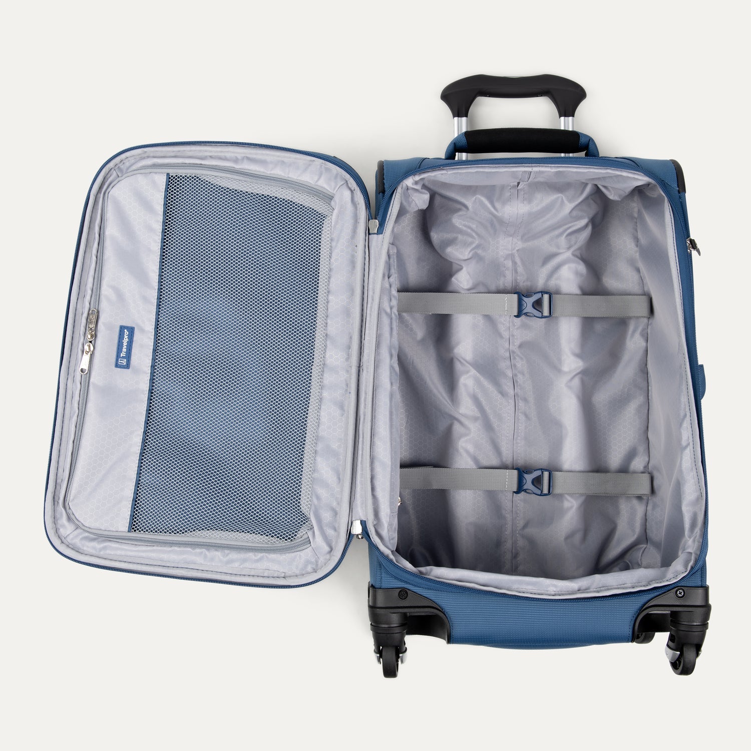 Open blue suitcase with interior organization panels on a white background
