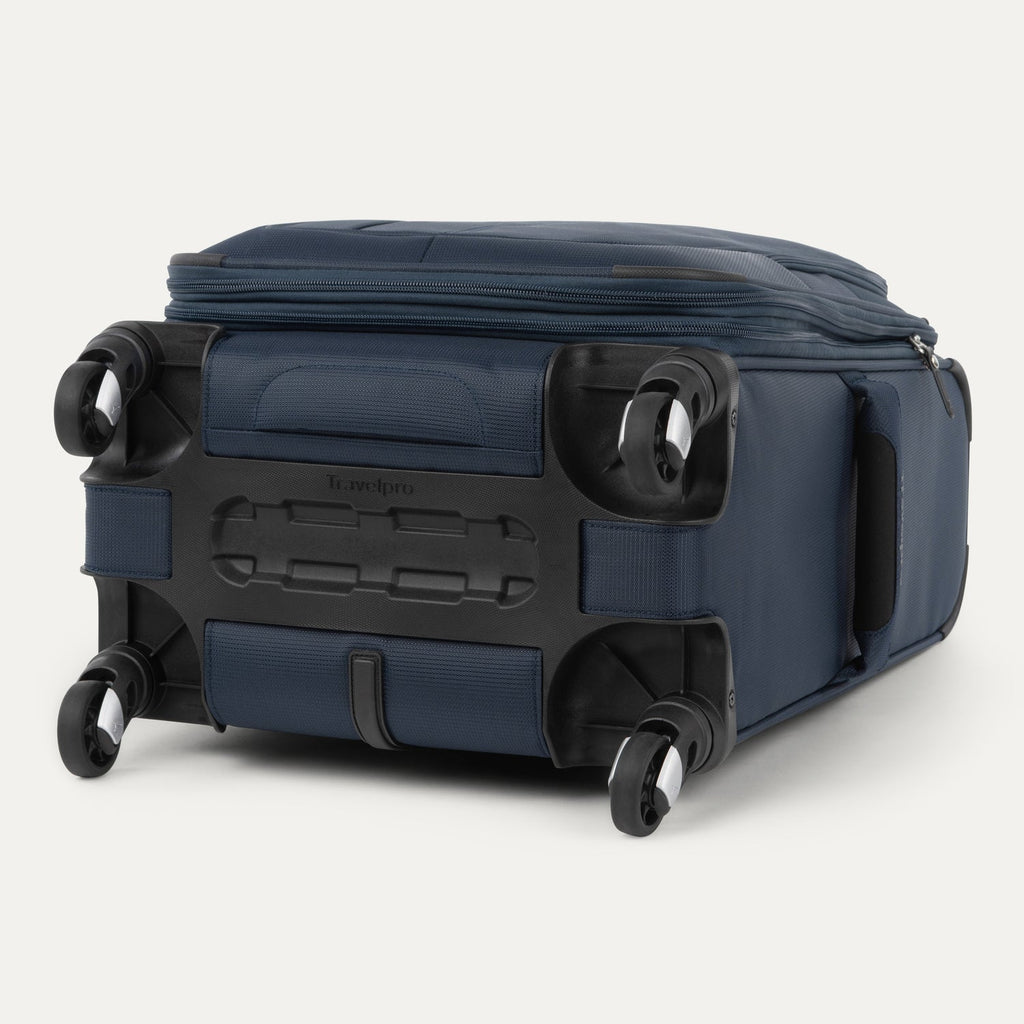 Blue suitcase with black wheels on a white background