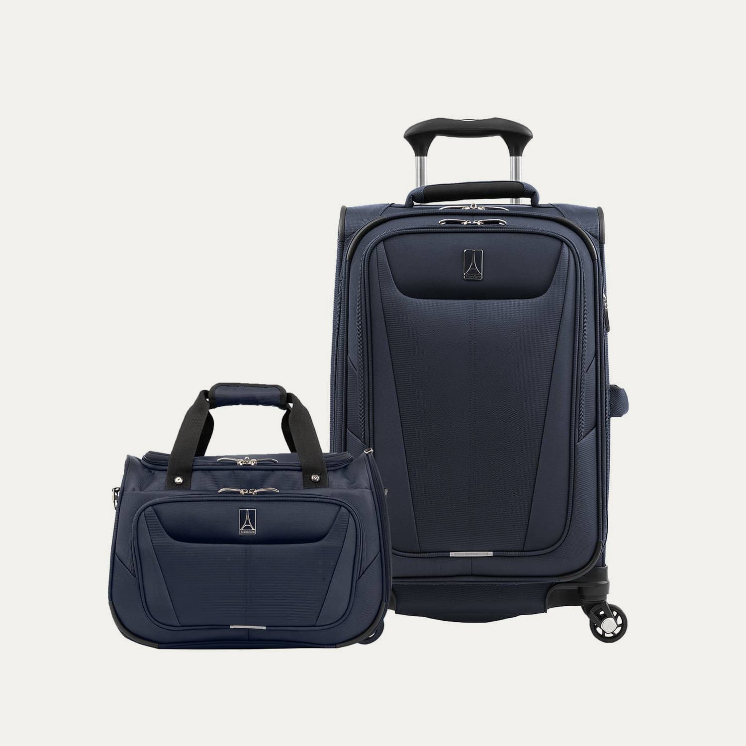 Navy blue suitcase and tote on a white background
