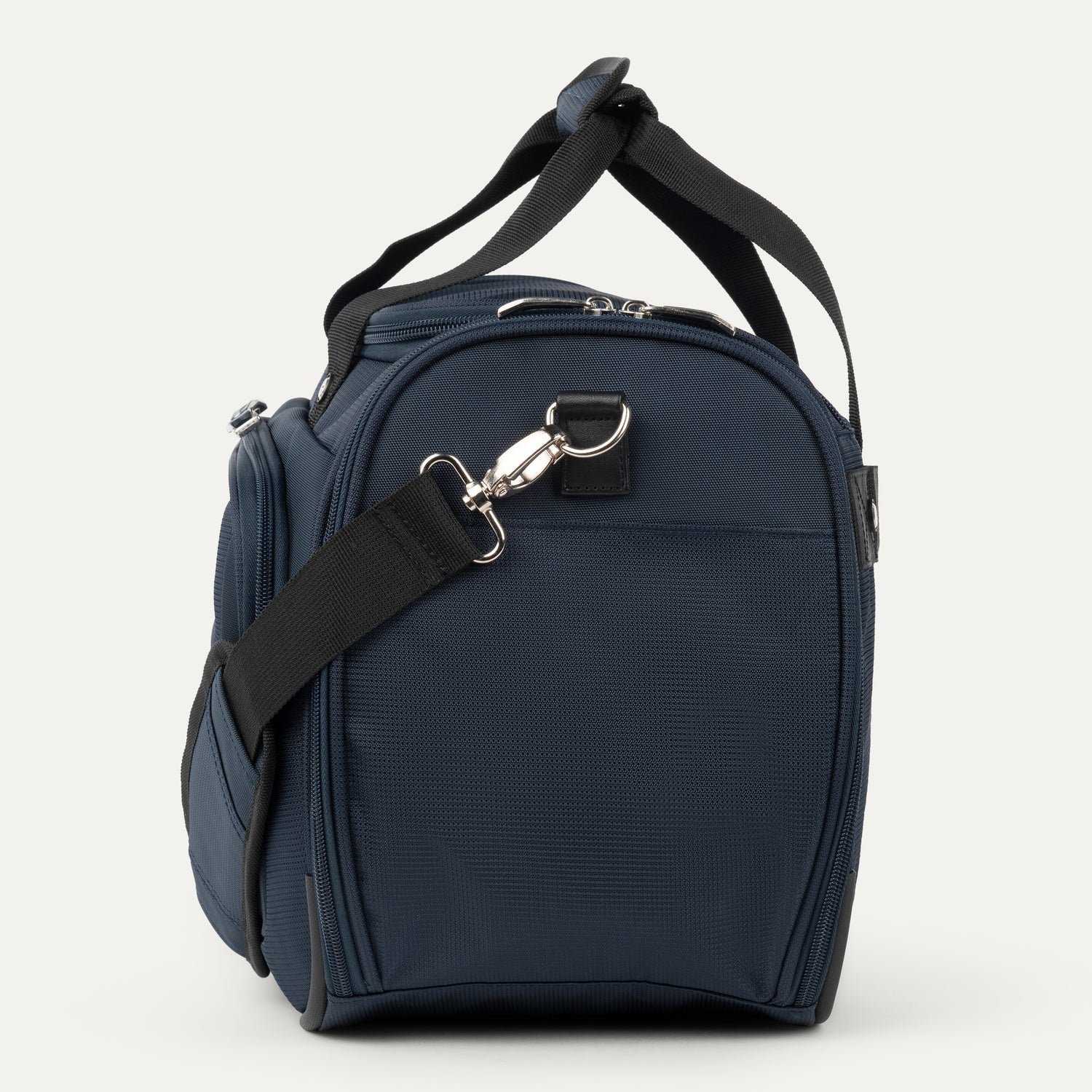 Side view navy blue bag with black strap on a white background
