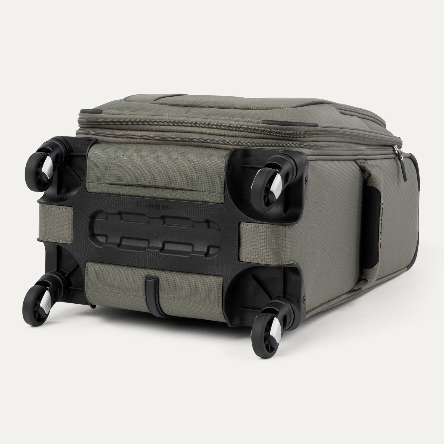 Green suitcase with black wheels on a white background