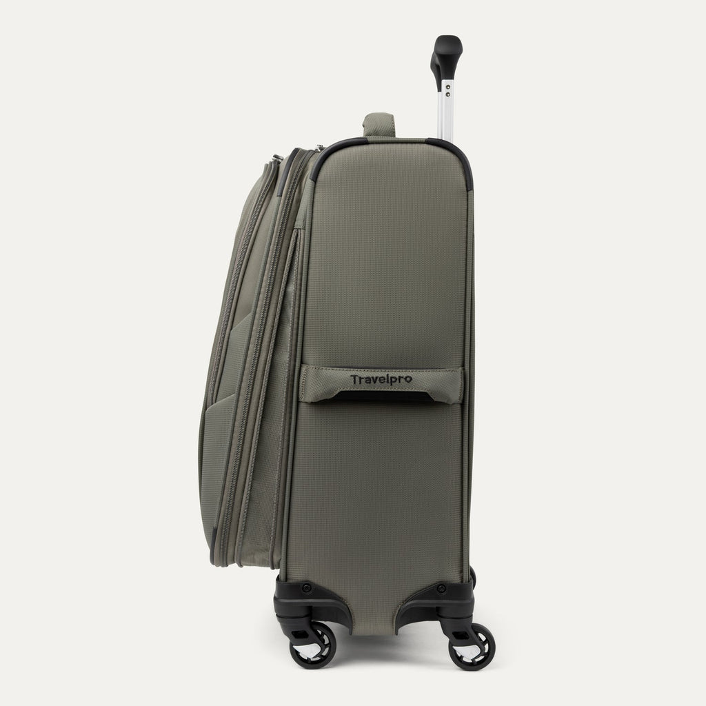 Green suitcase with 'Travelpro' branding on a white background