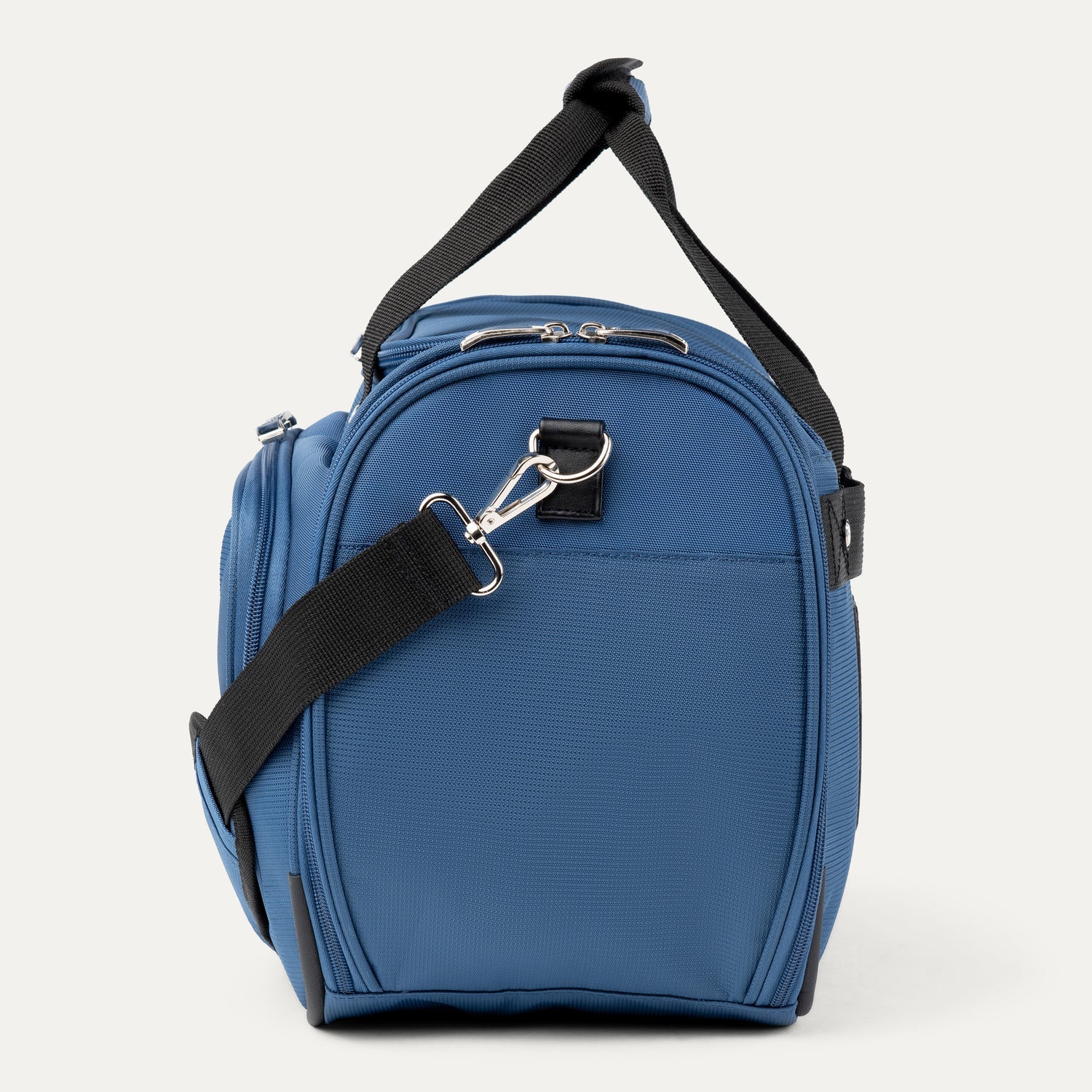 Side view of blue tote with black straps on a white background