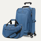Blue suitcase and duffel bag on a white background