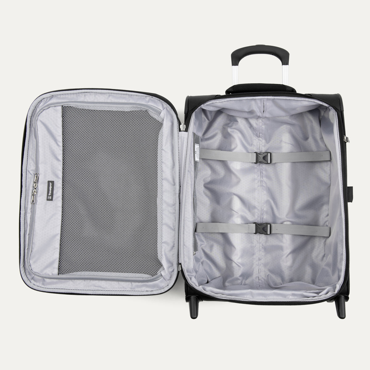 interior view of the open black travelpro maxlite 5 international carry-on rollaboard showing the light gray ecofab lining, a large mesh zippered lid pocket, and adjustable hold-down straps in the main compartment.