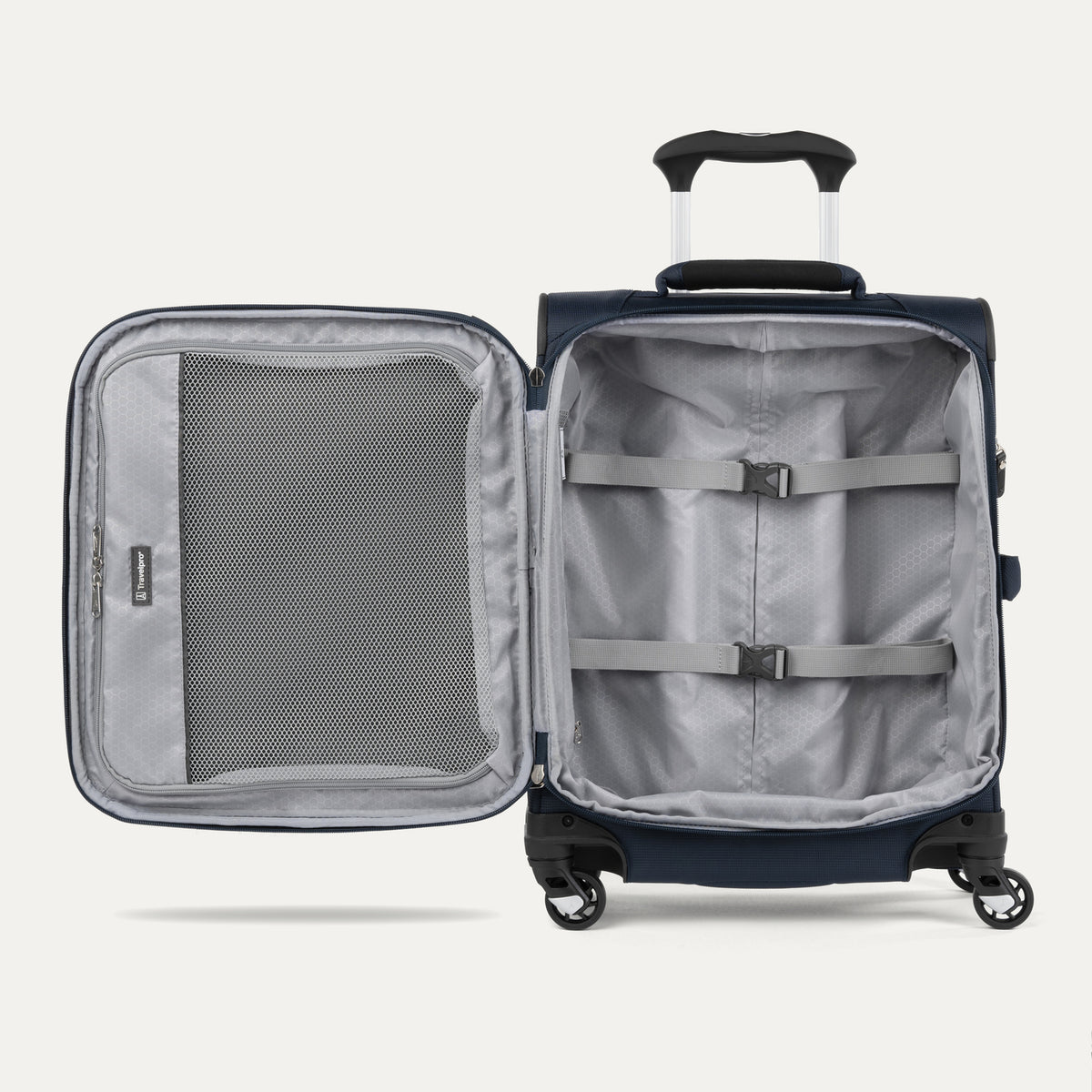 interior view of the open midnight blue travelpro maxlite 5 international carry-on spinner showing the light gray ecofab lining, a large interior mesh zippered lid pocket, and adjustable hold-down straps in the main compartment.