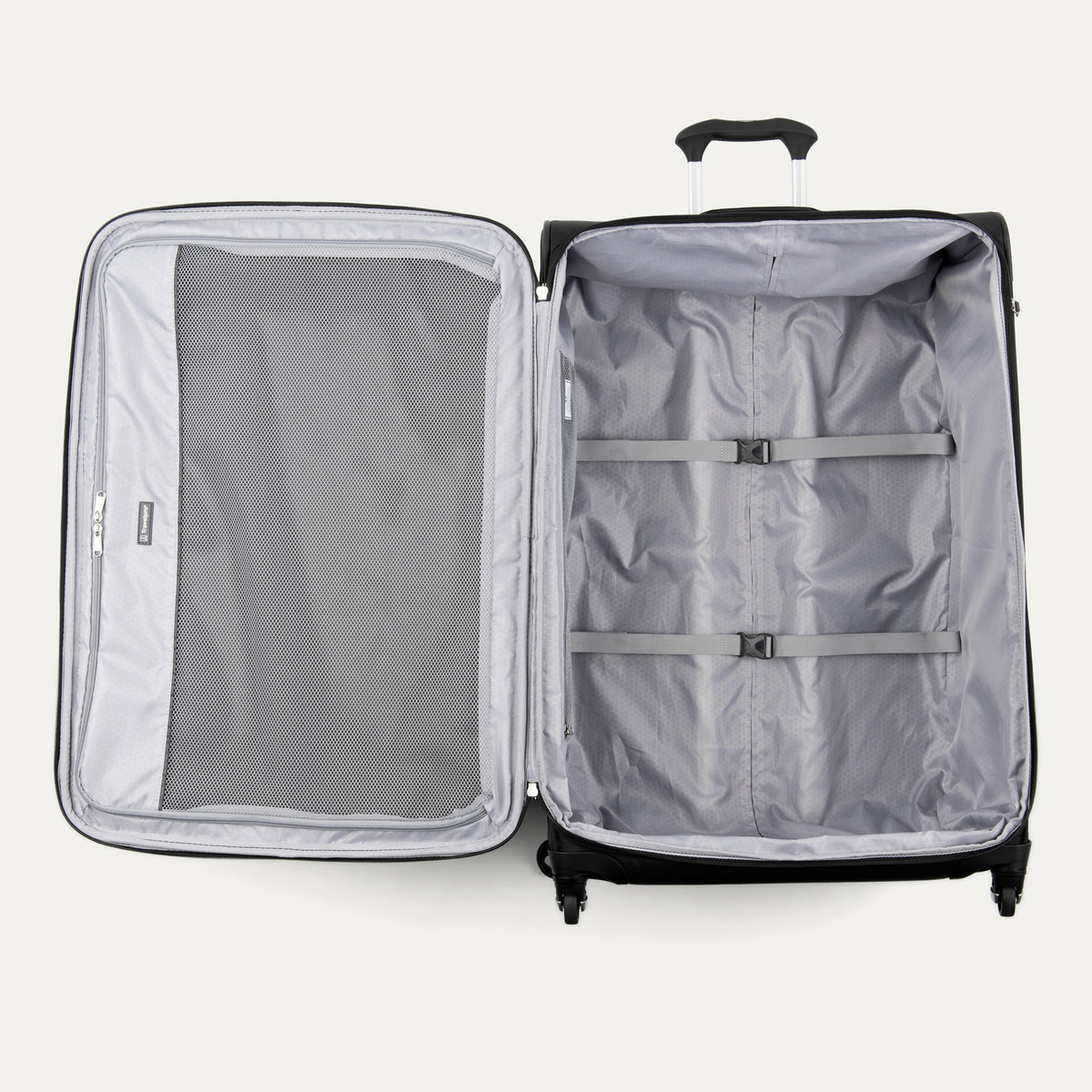 interior view of the open black travelpro maxlite 5 large check-in spinner showing the roomy main compartment with adjustable hold-down straps and a full-length interior lid pocket.