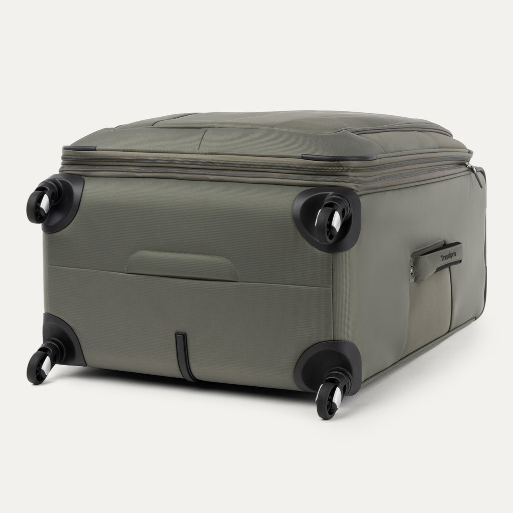 bottom and side view of the slate green travelpro maxlite 5 large check-in spinner showing the four 360 degree spinner wheels and the bottom molded handle cup for easy lifting.