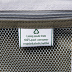 close up of the interior fabric tag on the slate green travelpro maxlite 5 large check-in spinner showing a green recycling symbol and text stating lining made from 100 percent post consumer recycled plastic bottles.