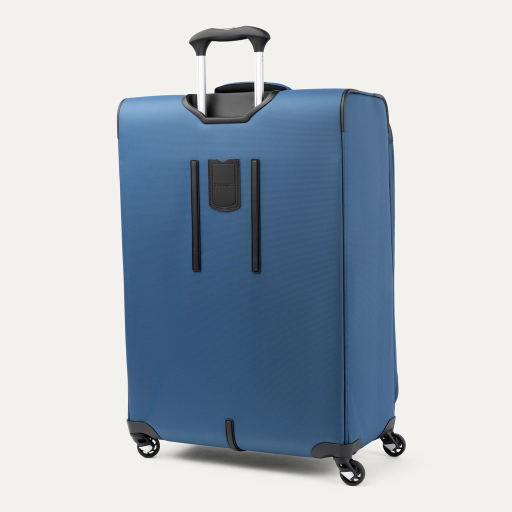 rear view of the ensign blue travelpro maxlite 5 large check-in spinner showing the adjustable powerscope lite handle and the integrated rear identification pocket.