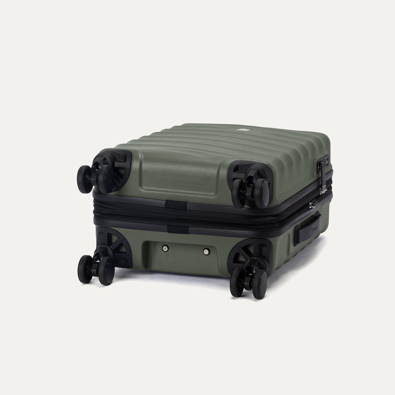Side view of Travelpro Maxlite Air V2 Carry-On Hardside Spinner in Slate Green, showing expandable zipper and Low-Profile Side Carry Handles.
