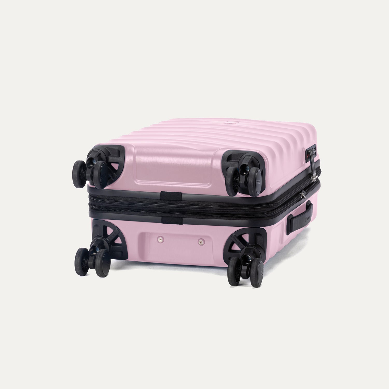 Bottom view of Travelpro Maxlite Air V2 Carry-On Expandable Spinner in Forever Pink, featuring 360° Spinner Wheels and Low-Profile Bottom Carry Handles.
