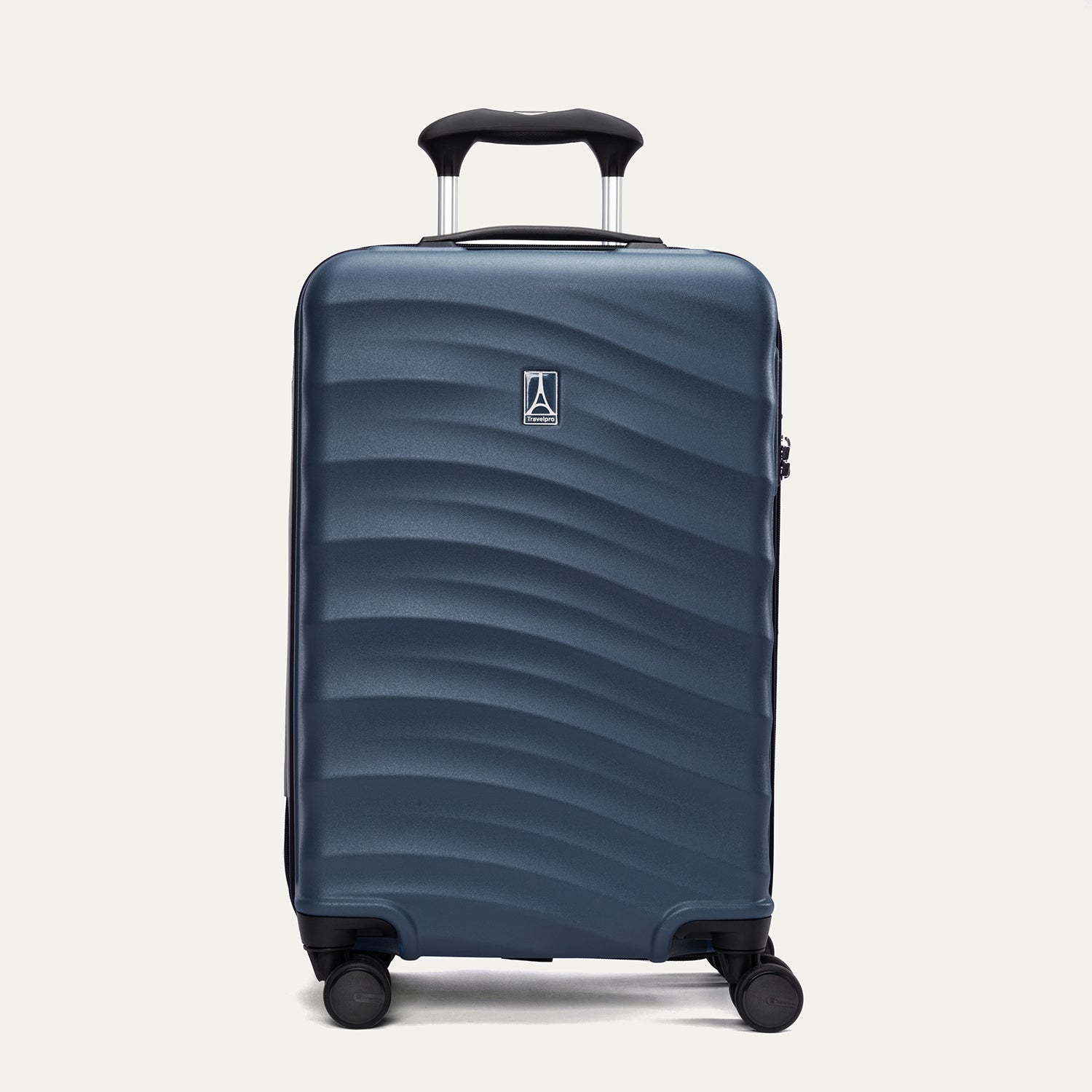 Front view of Travelpro Maxlite Air V2 Carry-On Spinner in Midnight Blue, featuring extended handle and textured hard shell.