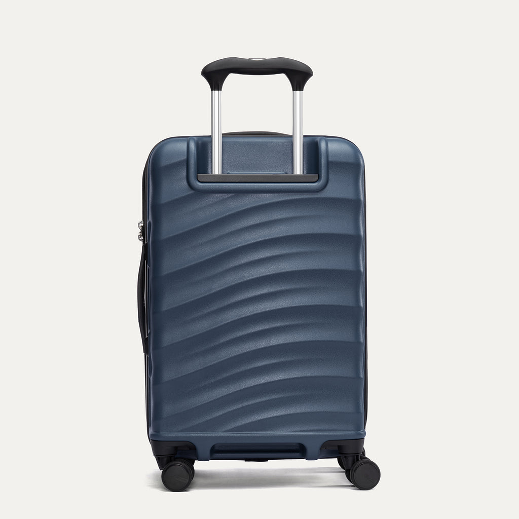 Rear view of Travelpro Maxlite Air V2 Spinner in Midnight Blue, showing the extended telescopic handle and side carry handle