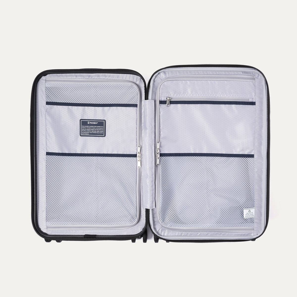 Interior view of Travelpro Maxlite Air V2 Spinner, featuring mesh zippered compartments for organized packing.
