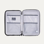 Interior view of Travelpro Maxlite Air V2 Spinner, featuring mesh zippered compartments for organized packing.
