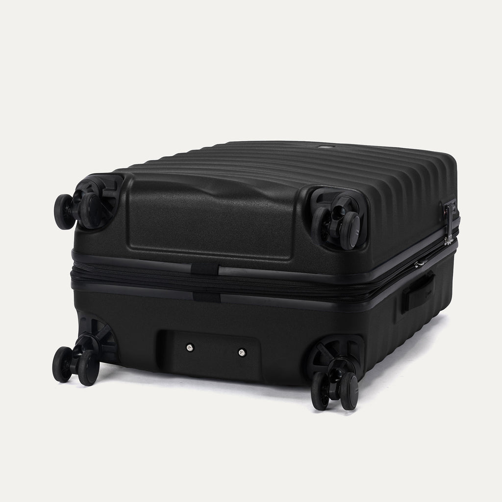 Bottom view of Travelpro Maxlite Air V2 Spinner in Black, featuring dual spinner wheels and visible side carry handle.