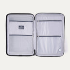 Interior view of Travelpro Maxlite Air V2 Spinner featuring mesh zippered compartments for organized packing.