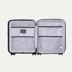 Interior view of Maxlite Air V2 featuring dual mesh zippered compartments for organized packing.
