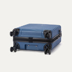 Bottom view of Travelpro Maxlite Air V2 Compact Carry-On Spinner in Ensign Blue, showing durable wheels and textured shell.