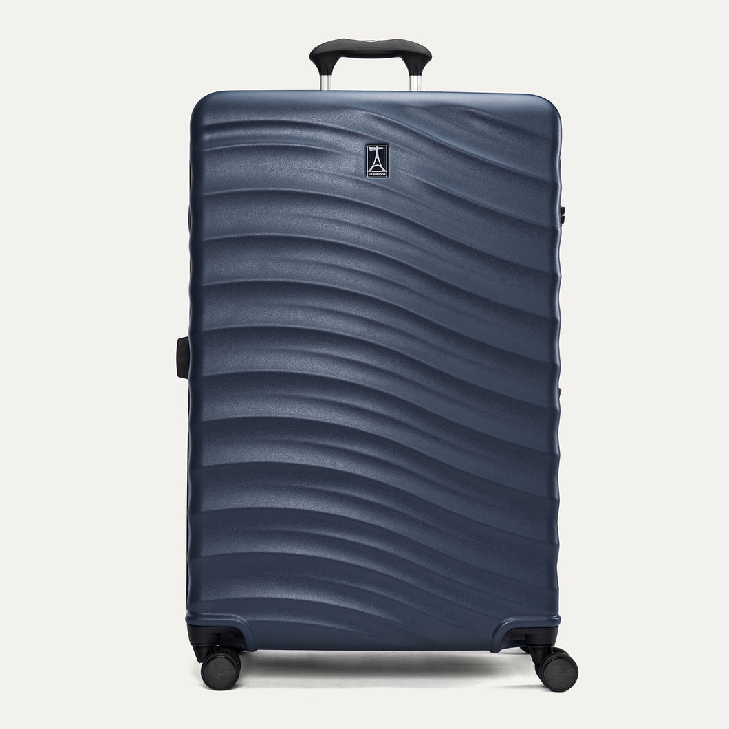 Front view of Travelpro Maxlite Air V2 Check-In Spinner in Midnight Blue, featuring a textured shell, top handle, and 360° spinner wheels. 