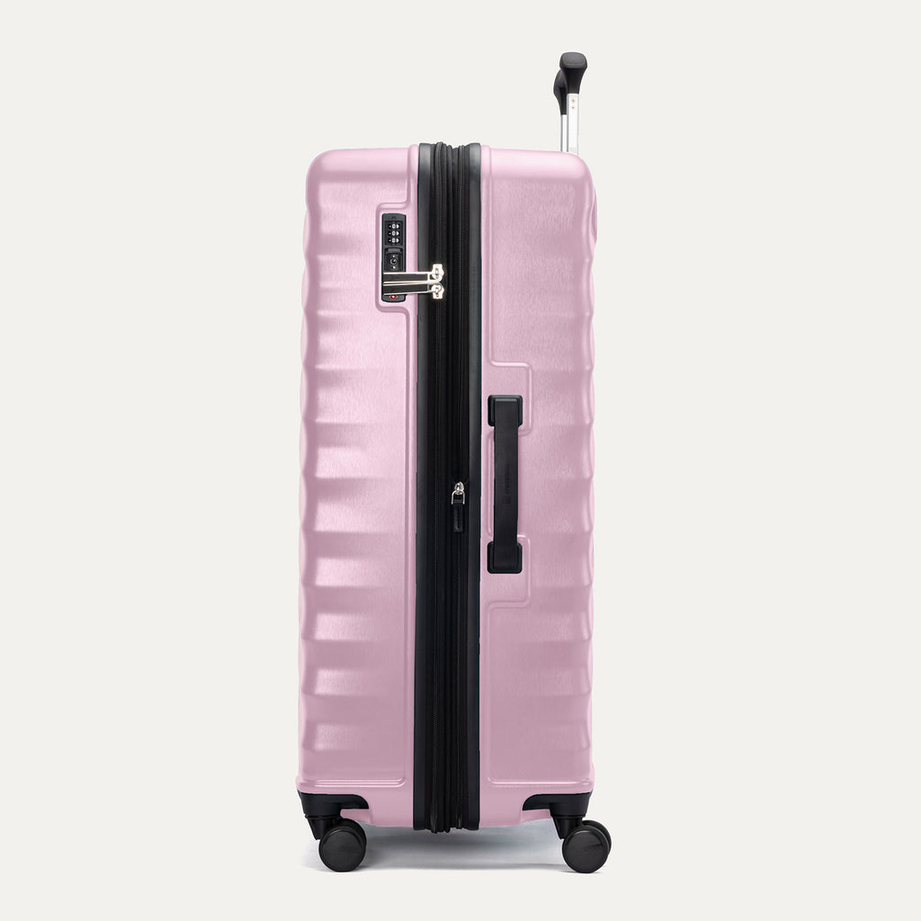 Side view of Travelpro Maxlite Air V2 Check-In Spinner in Orchid Pink, showing expandable zipper, Low-Profile Side Carry Handle, and extended PowerScope Lite Handle.
