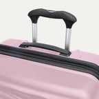 Top view of Travelpro Maxlite Air V2 Check-In Spinner in Orchid Pink, featuring the Contour Grip and PowerScope Lite Handle.