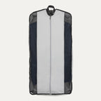A black and gray Travelpro Essentials Drop-in Garment Sleeve with a zippered center opening and mesh side panels.