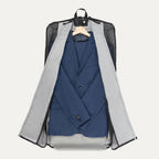 Travelpro® Essentials™ Drop-in Garment Sleeve opened to reveal a neatly packed  suit