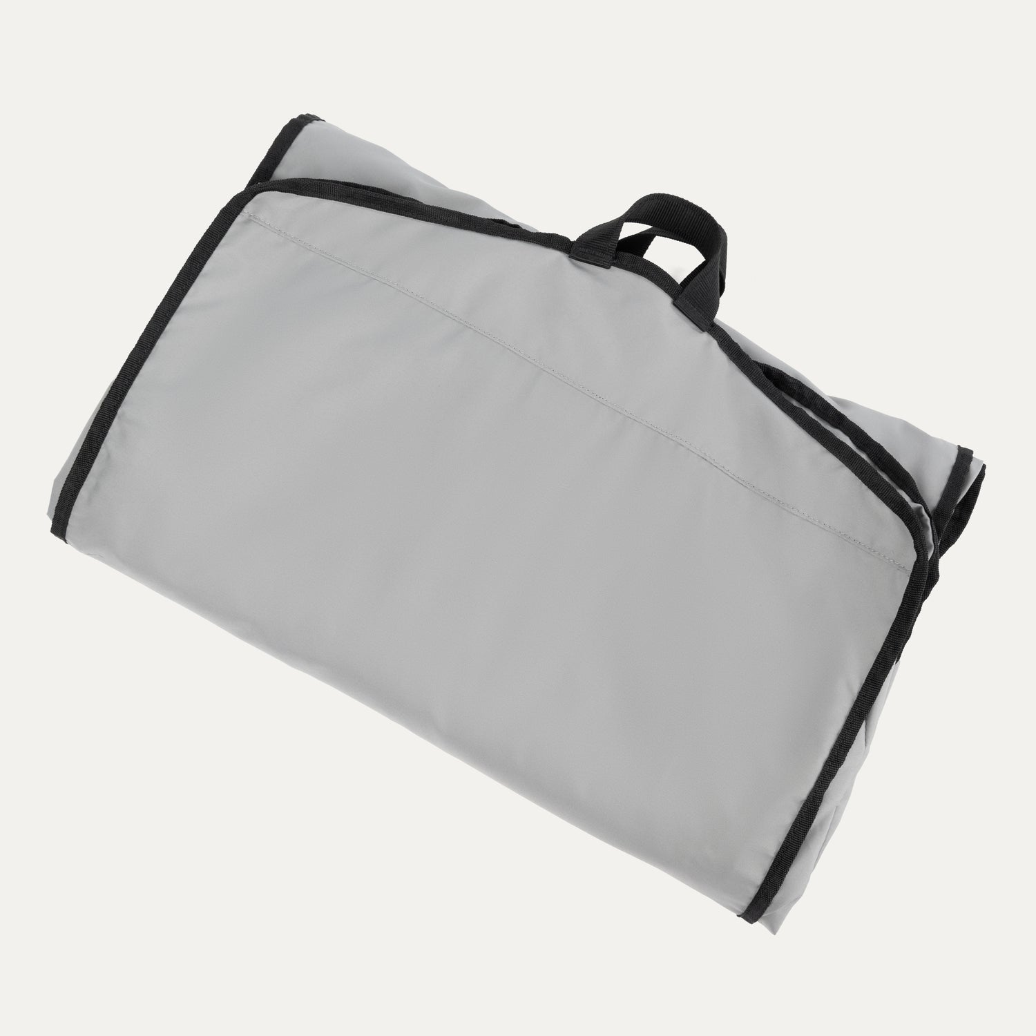 Travelpro® Essentials™ Drop-in Garment Sleeve shown folded and secured with black edge trim and a top carrying handle for easy transport.