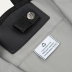 Close-up of the Travelpro® Essentials™ bag interior tag, showing the eco-friendly lining made from 100% post-consumer recycled plastic bottles