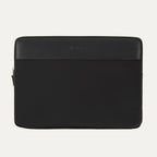 Black Travelpro Essentials padded laptop sleeve with leather trim and a zipper.