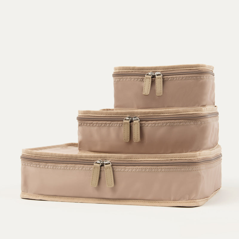 Front view of Travelpro Essentials 3 Pack Packing Cube Set (S/M/L) in KHAKI, stacked to display uniform dual-zip closures.