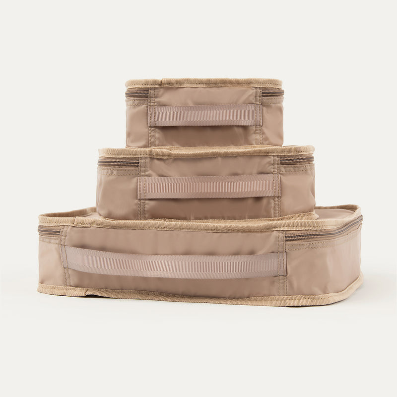 Rear view of Travelpro Essentials 3 Pack Packing Cube Set (S/M/L) in KHAKI, showing stacked cubes with reinforced grab handles.