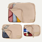 Top view of Travelpro Essentials 3 Pack Packing Cube Set (S/M/L) in KHAKI, partially open to reveal organized contents.
