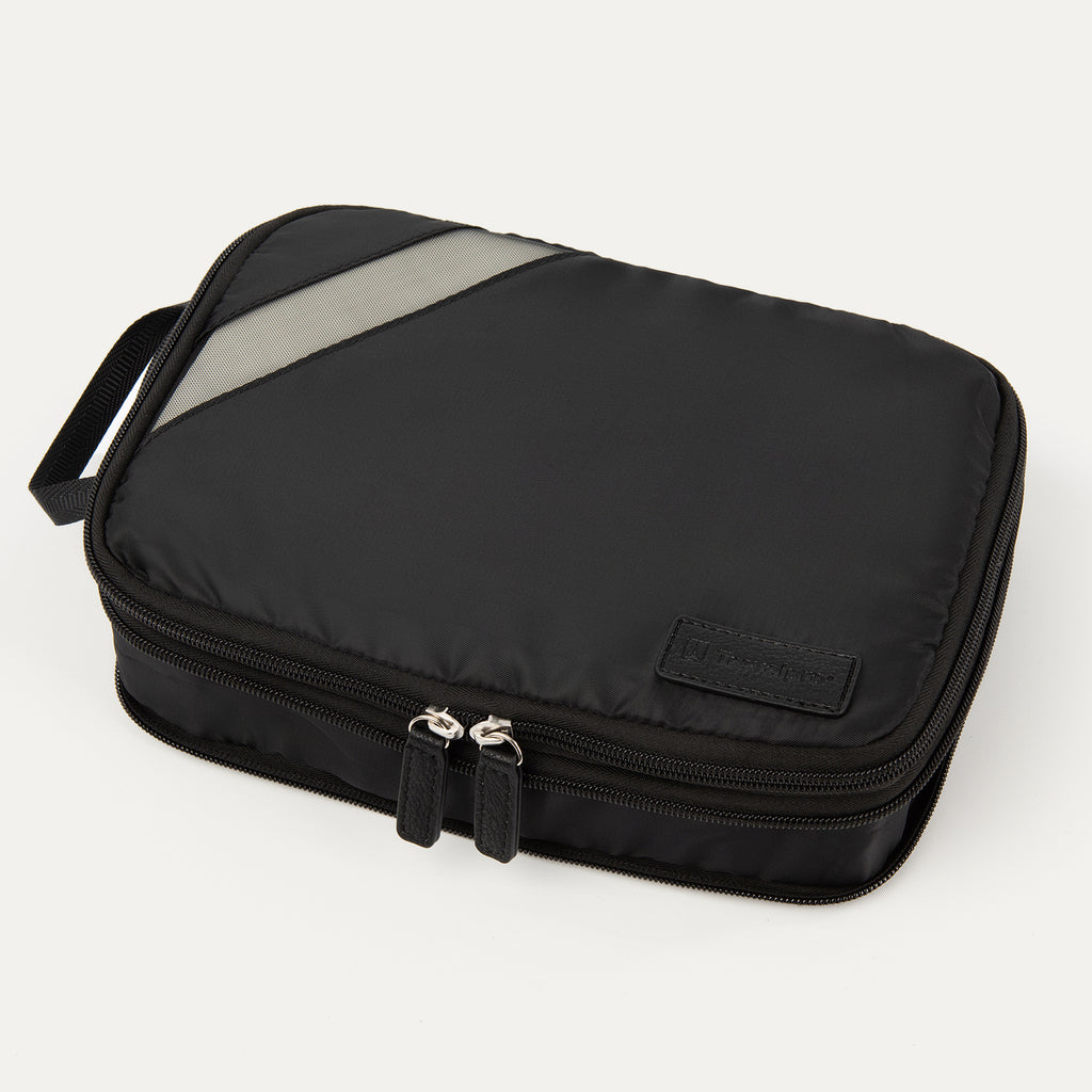A black Travelpro Essentials medium expandable/compressible packing cube with a silver zipper.