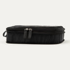 Front compressed view of the Travelpro® Medium Packing Cube in black with dual zipper closures and a side handle.