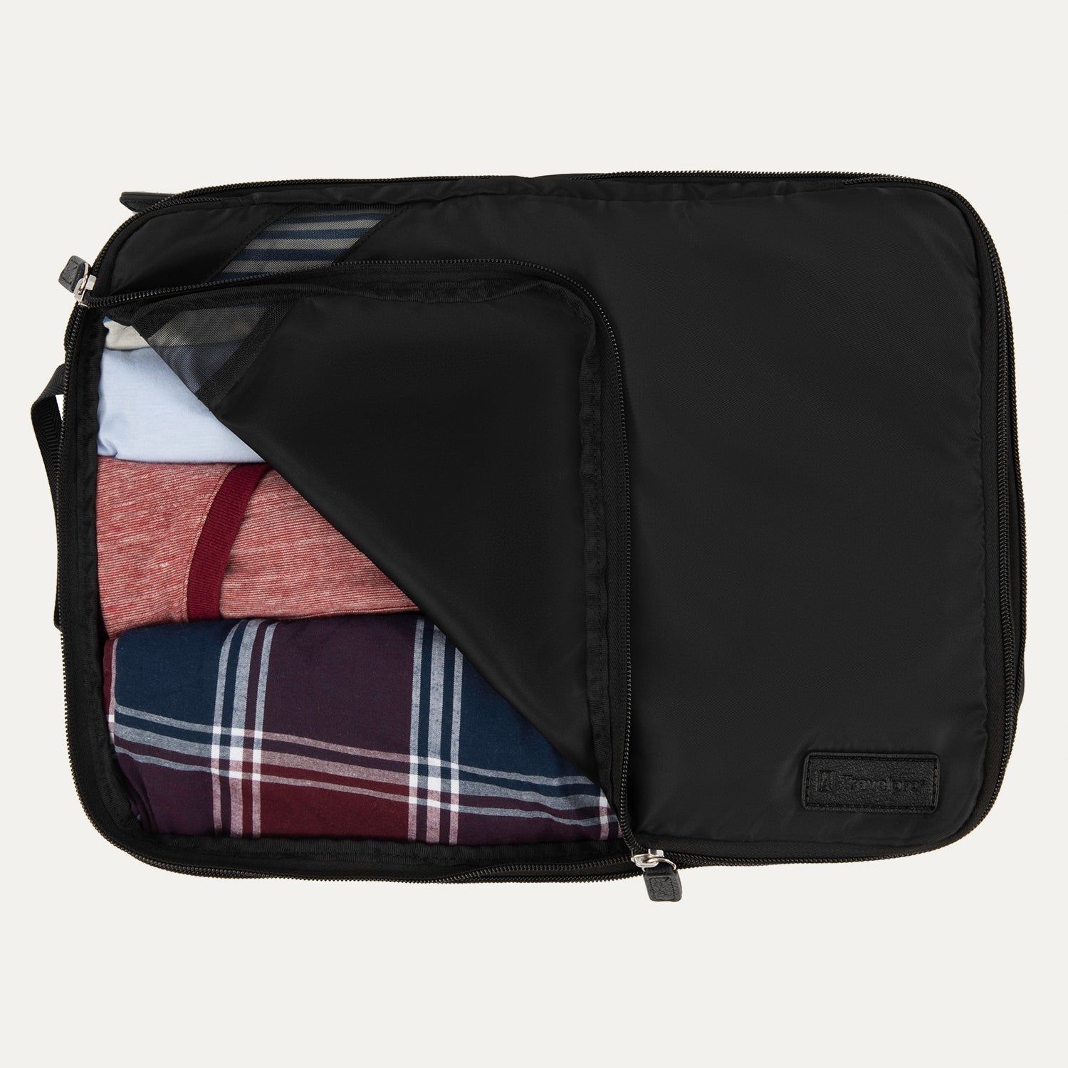 Large Travelpro packing cube in black with mesh panel, partially unzipped to reveal rolled clothing inside.
